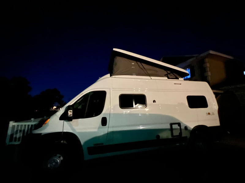  and scenic rear window views.|Interior view of an RV rental showing passenger seating — photo 18