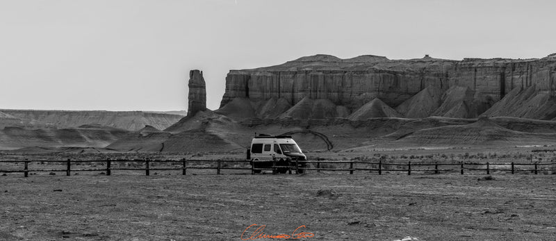  & a warm campfire create a cozy scene in a vast landscape.|Interior view of an RV rental: front cabin with steering wheel — photo 11