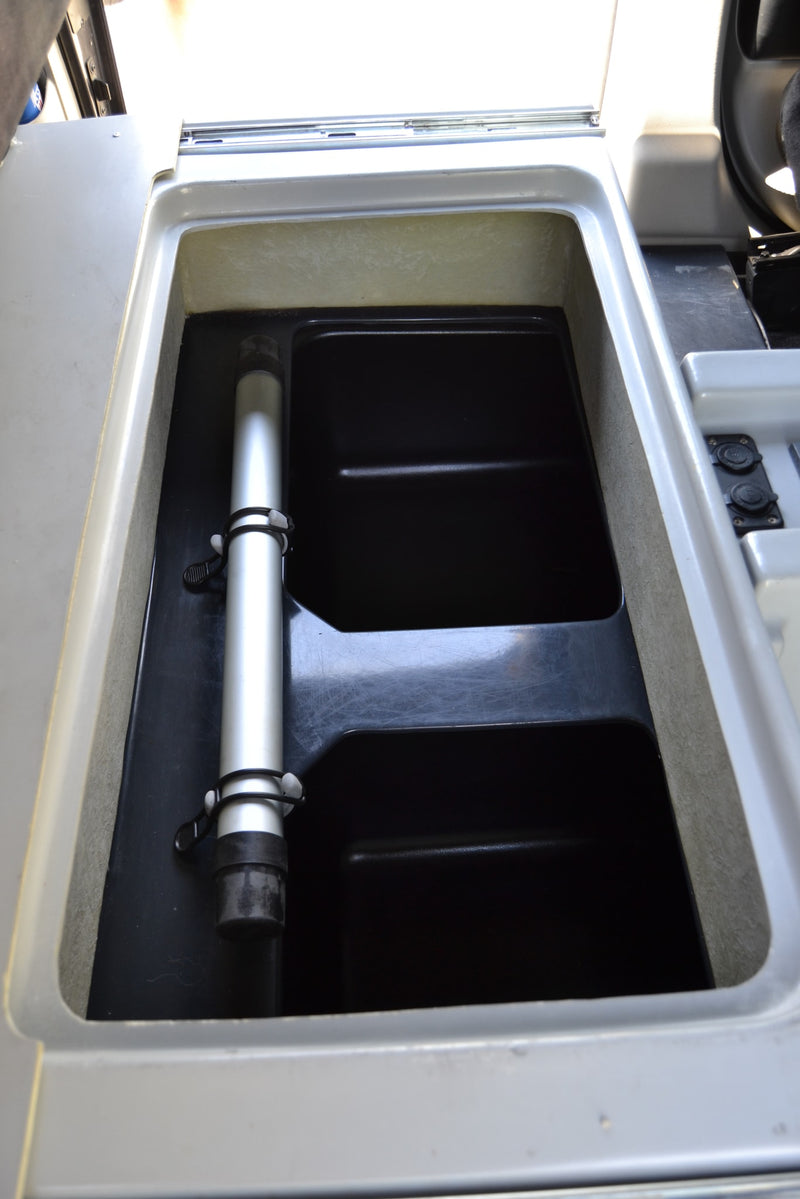  and fire extinguisher.|An open Dometic pull-out refrigerator in an RV rental reveals its interior storage — photo 16