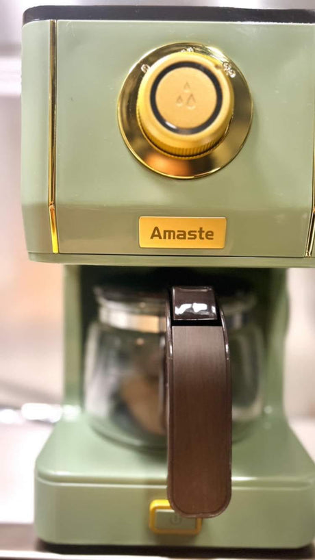 This stylish Amaste coffee maker in retro sage green is perfect for any kitchen, including an RV rental.