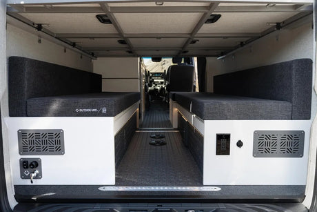 Modern rv rental van interior with comfy twin bench beds & essential utilities. Ready for your road trip comfort.