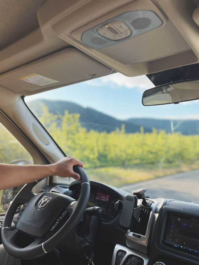  and overhead AC unit with open rear doors.|RV rental escape: Enjoying a charcuterie picnic with wine on a wooden table — photo 6