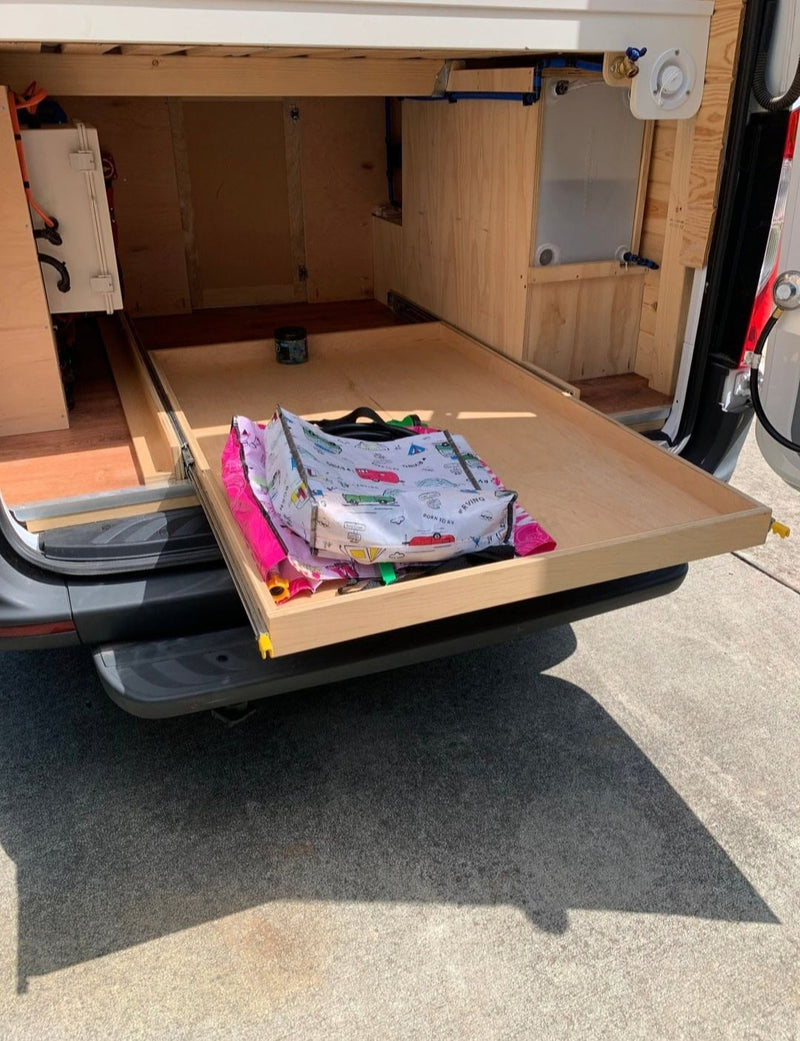  and Titans canopy. Perfect for outdoor adventures.|RV rental camper van: Rear view of interior with bed — photo 9