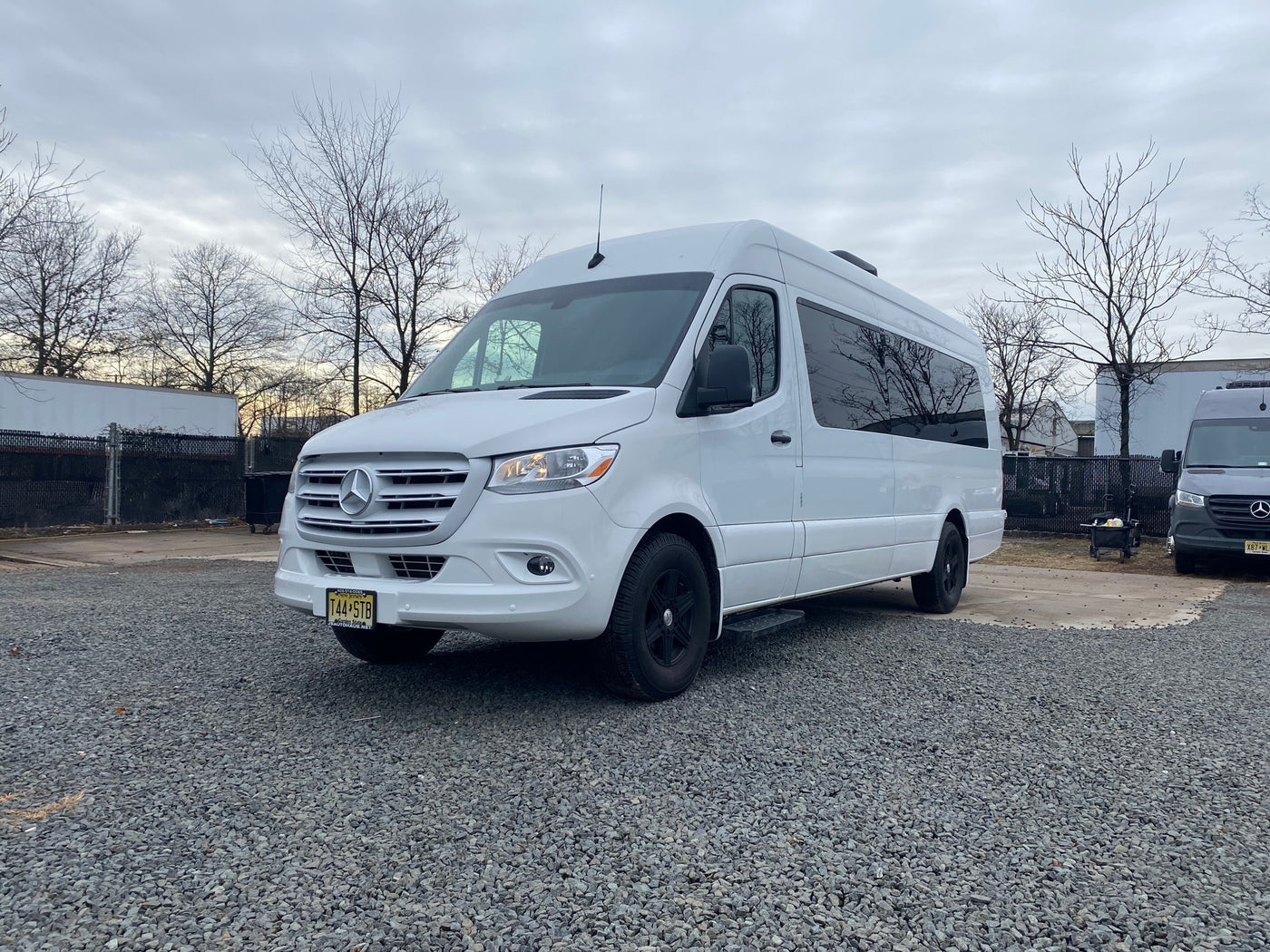 A clean white Mercedes-Benz Sprinter van on gravel. Great for RV rental & road trips in New Jersey. — photo 16