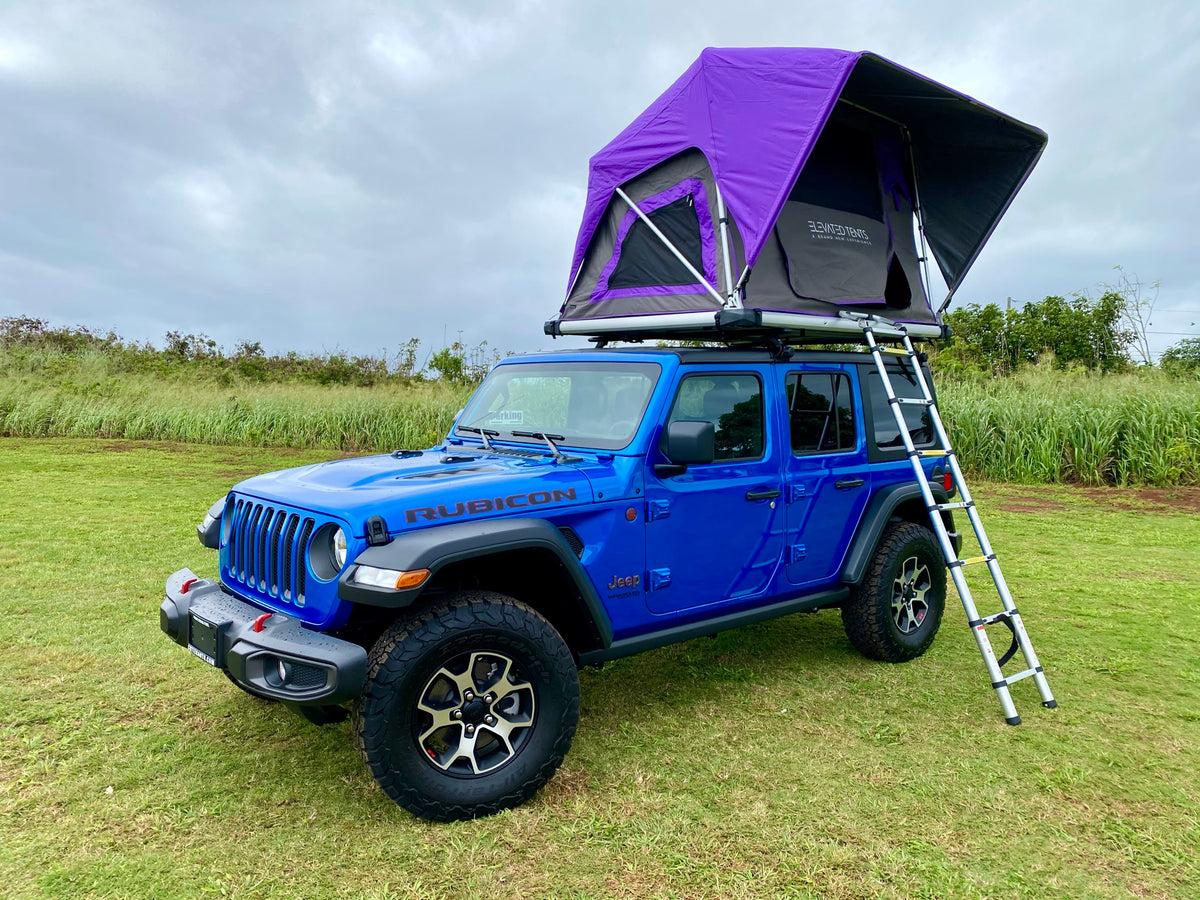 This blue Jeep Wrangler with a purple rooftop tent is available for RV rental, perfect for overlanding & camping. — photo 7