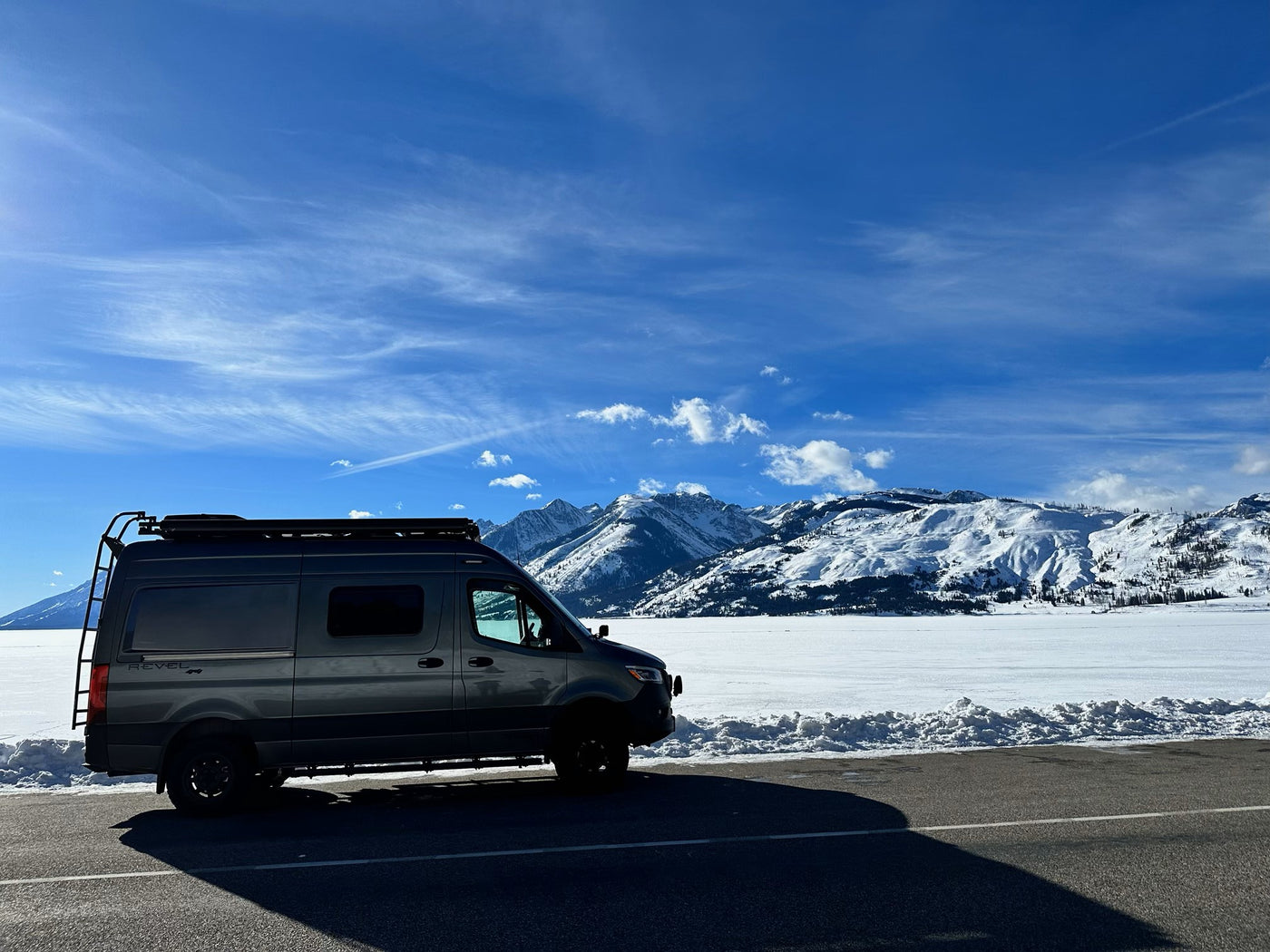  parked on a sunny day. Ideal for outdoor adventures.|Vibrant RV rental Sprinter van lit up at night on a dirt road.|Night desert camping: An RV rental parked under a cloudy sky — photo 7