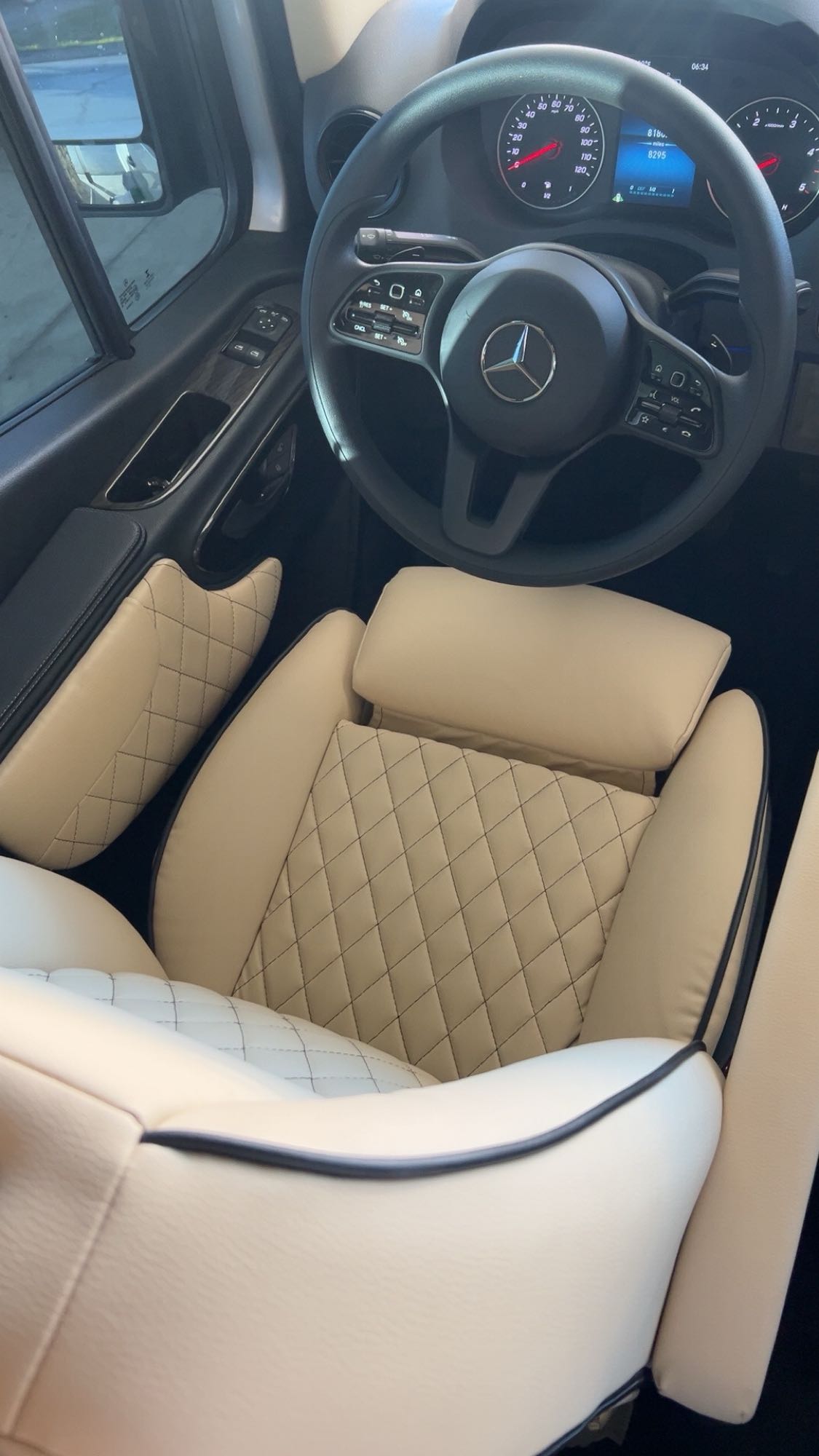 Step into this luxurious Mercedes-Benz RV rental! Features cream, diamond-quilted seats and a modern dashboard for ultimate comfort.