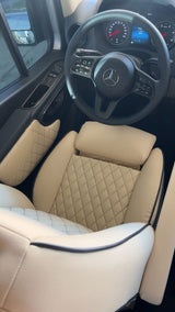 Step into this luxurious Mercedes-Benz RV rental! Features cream, diamond-quilted seats and a modern dashboard for ultimate comfort.