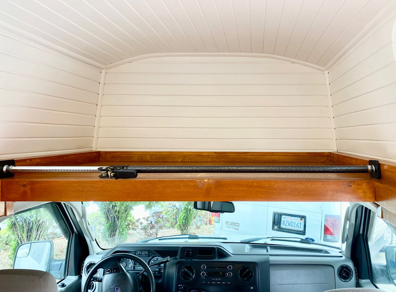  and a silver Lagun table base.|RV rental storage: Hand lifts top flap revealing organized kitchenware – pots — photo 13