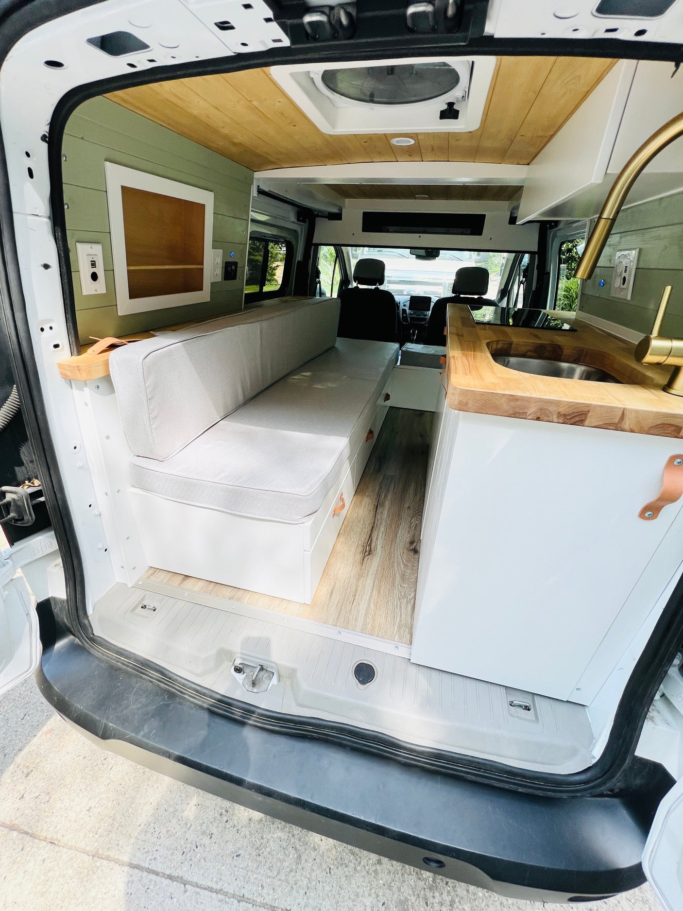 Step inside this beautifully converted campervan! Ideal for your next RV rental adventure, featuring a full kitchen & cozy seating area.