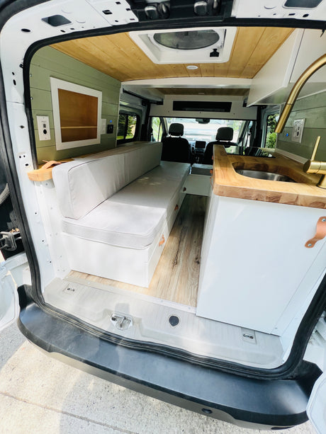 Step inside this beautifully converted campervan! Ideal for your next RV rental adventure, featuring a full kitchen & cozy seating area.