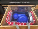 RV rental: Optional dishes & utensils, neatly organized in a wooden compartment with a clear bin & red storage bag.