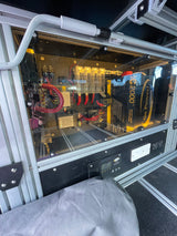 RV rental power system: Go Power! 2000W inverter, solar controller, and wiring in a clear enclosure for mobile use.