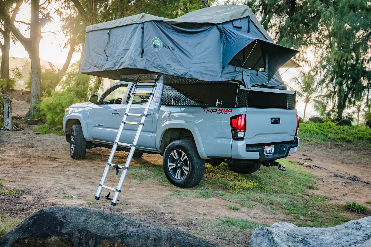  ladder & bed storage – an ideal RV rental.|This grey Tacoma pickup with a rooftop tent makes for a unique RV rental