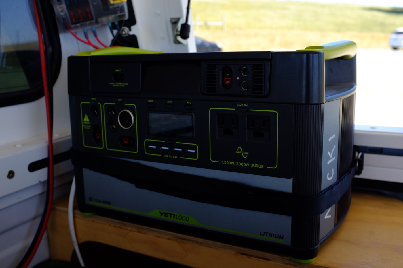 A black Goal Zero Yeti 1000 Lithium portable power station in an rv rental. It features AC/USB ports, 1500W, perfect for camping. — photo 10