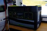 A black Goal Zero Yeti 1000 Lithium portable power station in an rv rental. It features AC/USB ports, 1500W, perfect for camping.