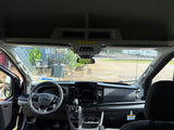 RV rental ready: interior view of a modern Ford Transit van, showing the dashboard, steering wheel, and infotainment screen.