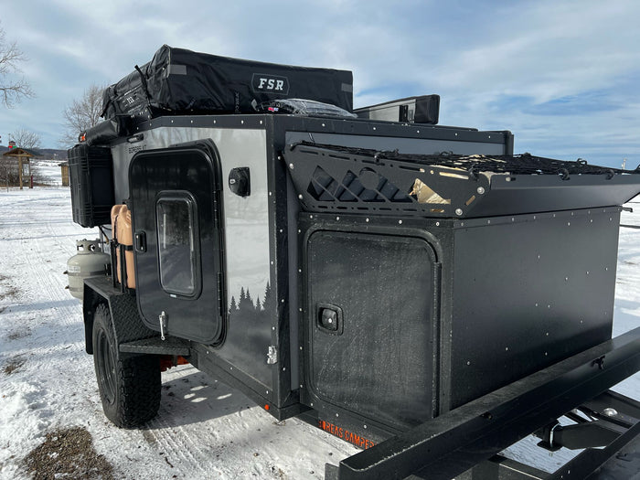 Boreas XT off-road camper, ideal for RV rental adventures! Ready for snow camping with its rooftop tent & rugged build.