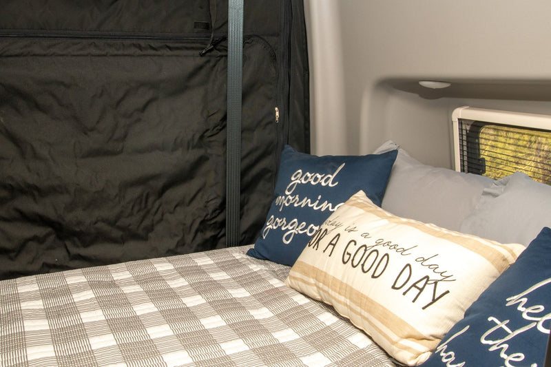  customized interior with storage units.|Inside an RV rental: a compact wet bath featuring a toilet — photo 11