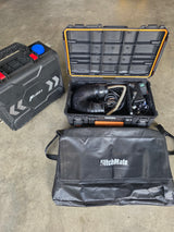 Portable MCalory diesel heater system in black cases for RV rental adventures, with a HitchMate bag.