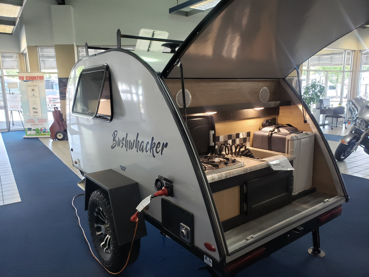 Explore this Bushwhacker teardrop RV, perfect for your next rv rental adventure with its compact outdoor kitchen. — photo 4