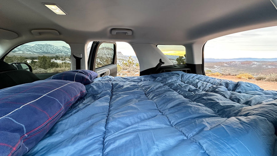  offers an agile alternative to an RV rental.|Cozy car camping setup inside an SUV
