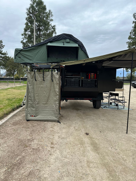 Experience outdoor living with this overland trailer, featuring a rooftop tent & privacy shower, great for RV rental or camping!