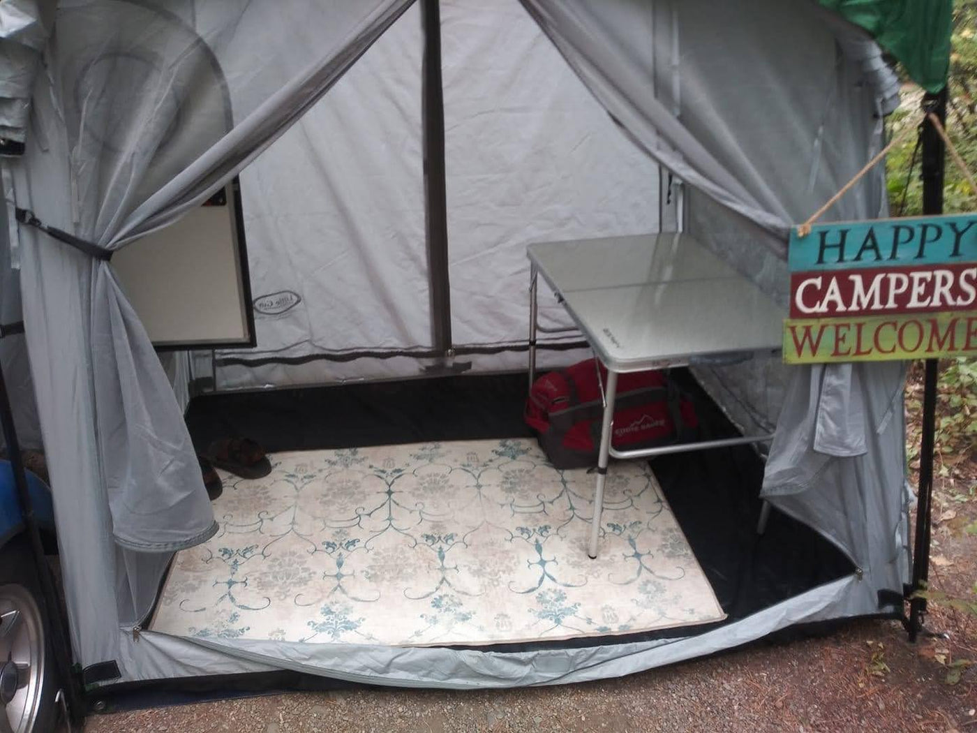  perfect for camping.|Outdoor camping with a compact RV rental & Subaru.|Serene campsite with a teardrop RV rental parked on a paved pad — photo 3