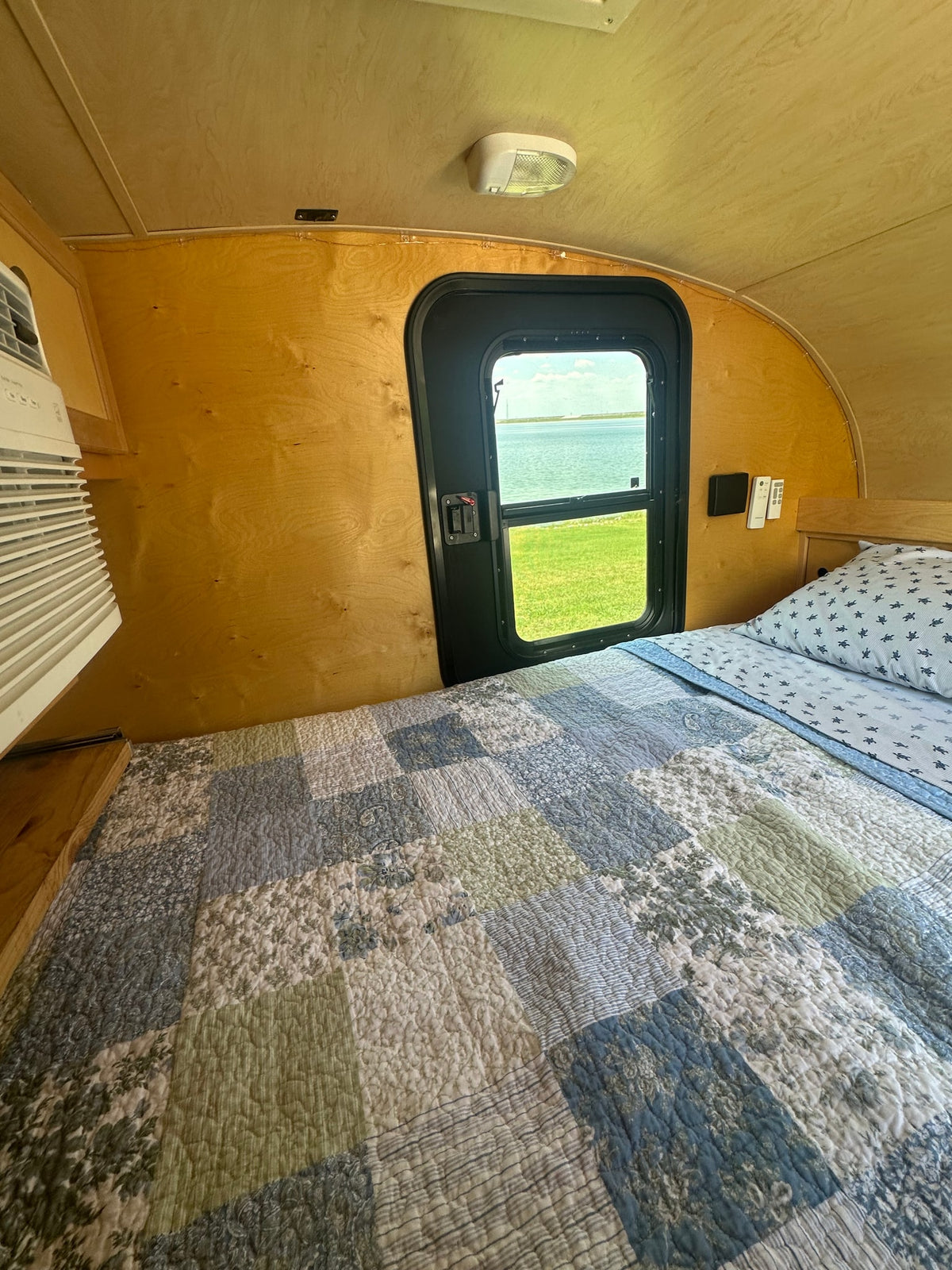  inviting sleeping space.|Comfortable RV rental interior featuring a bed with turtle-patterned sheets — photo 10