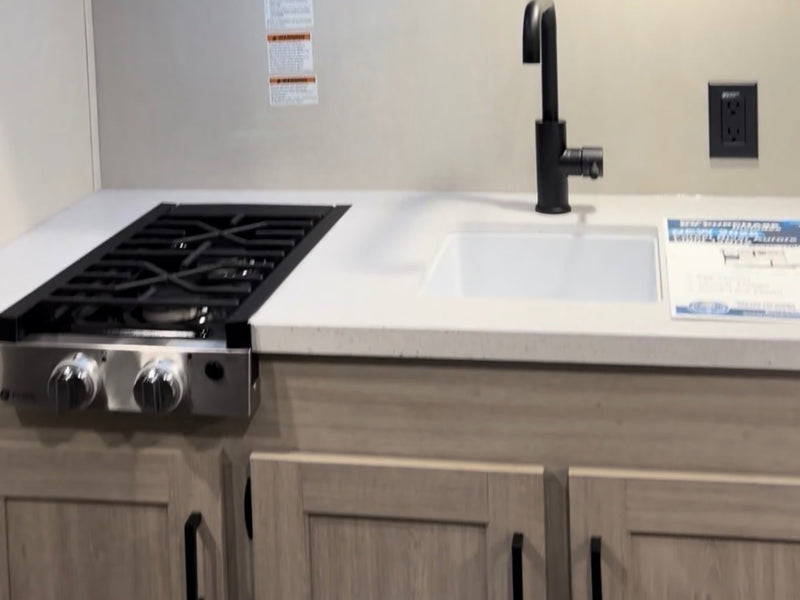  and open exterior storage. Ready for adventure.|View of a compact RV rental. The bedroom with a bed and window is seen through the open door — photo 4