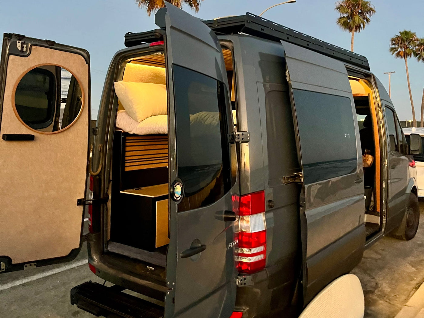  alongside classic vehicle controls.|This custom grey camper van RV rental — photo 9