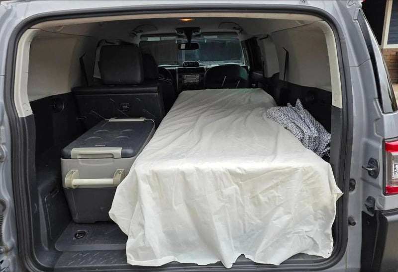  backed by a forest under a stunning orange/pink sunset. Ready for your rv rental adventure!|Inside a grey SUV — photo 2