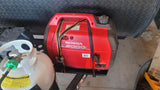 RV rental setup: Honda EU2000i generator and propane tank secured for travel, ready for adventure and off-grid power.
