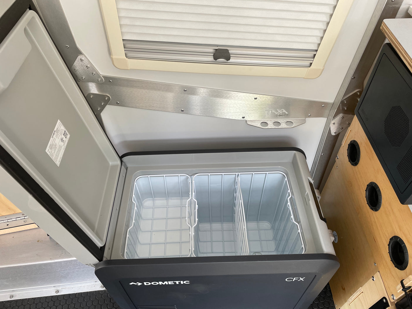 RV rental interior with an open Dometic CFX portable fridge/freezer, ready for your food storage needs.