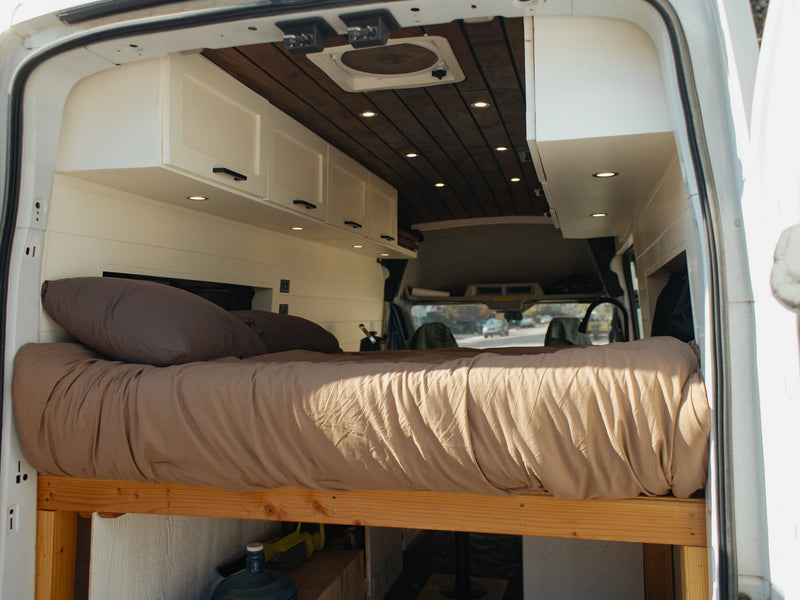  and a cozy bed. Ready for your next road trip adventure.|RV rental van conversion kitchen: gas stove — photo 13