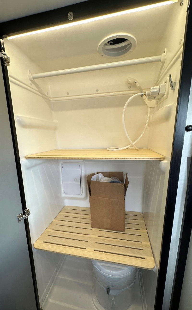  and a cozy bed in the rear.|RV rental control panel: Zamp Solar charge controller (13.4V) — photo 8