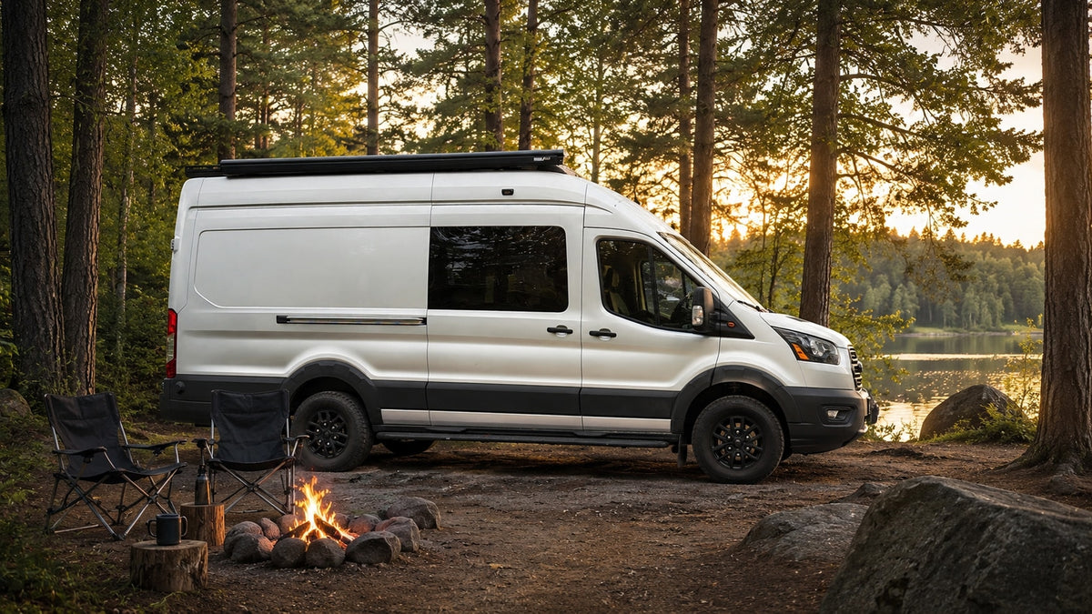 Experience nature with this rv rental camper van. Parked by a lake in a forest campsite