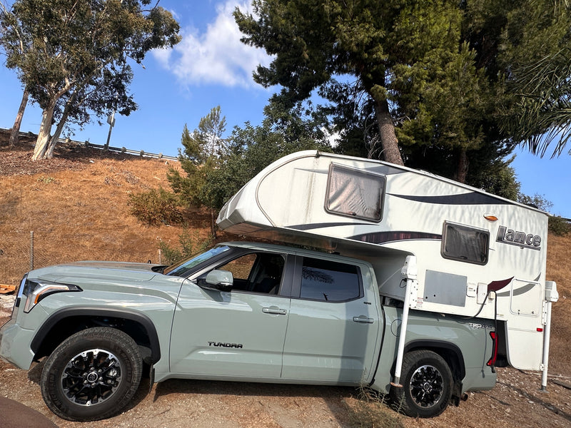  perfect for an RV rental outdoor trip.|Light green Toyota Tundra with a Lance truck camper — photo 10