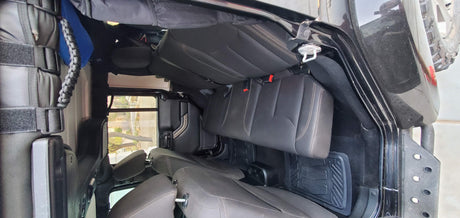 Inside an **RV rental** SUV: black seats, versatile cargo space, and rugged floor mats. Ready for any trip.