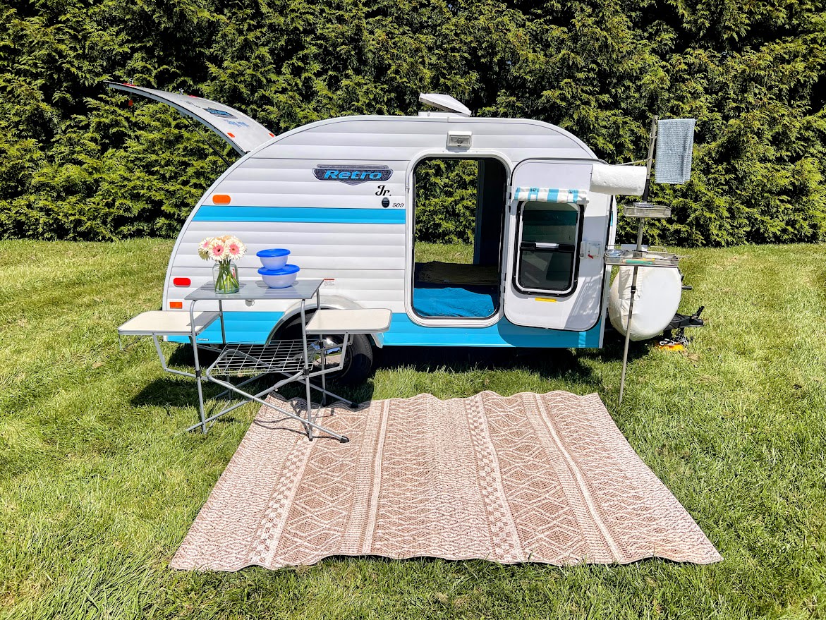  and a window view of nature.|Compact & convenient RV rental outdoor kitchen — photo 4