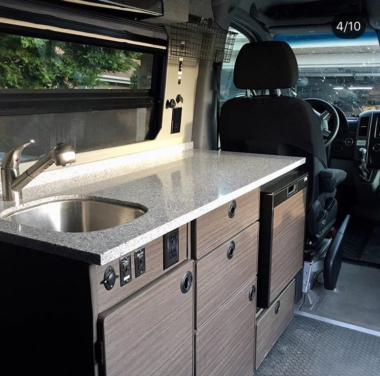  is ready for off-road adventures at sunset.|RV rental's pop-up tent interior: a cozy sleeping area with light tan fabric walls — photo 9