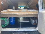 Experience van life in this RV rental style camper van. Raised bed, under-bed storage, solar, and power setup visible.