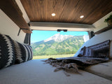 Experience serene van life! This cozy RV rental offers stunning mountain views from a comfortable interior. Perfect nature escape.