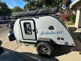 Bushwhacker teardrop travel trailer, perfect for your next RV rental camping trip or outdoor adventure.