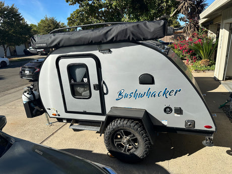 Bushwhacker teardrop travel trailer, perfect for your next RV rental camping trip or outdoor adventure.