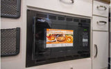 An efficient High Pointe Speed Cook microwave in an RV rental kitchen, integrated into white cabinetry, perfect for quick meals on the go.