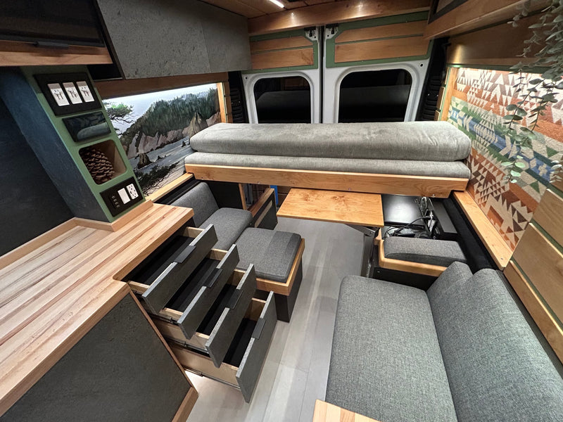  reflecting in the sand.|Explore the open road in this RV rental! Enjoy a warm wood interior — photo 4
