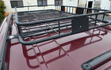 Roof-mounted cargo basket on a maroon vehicle, perfect for extra storage on your RV rental adventure.