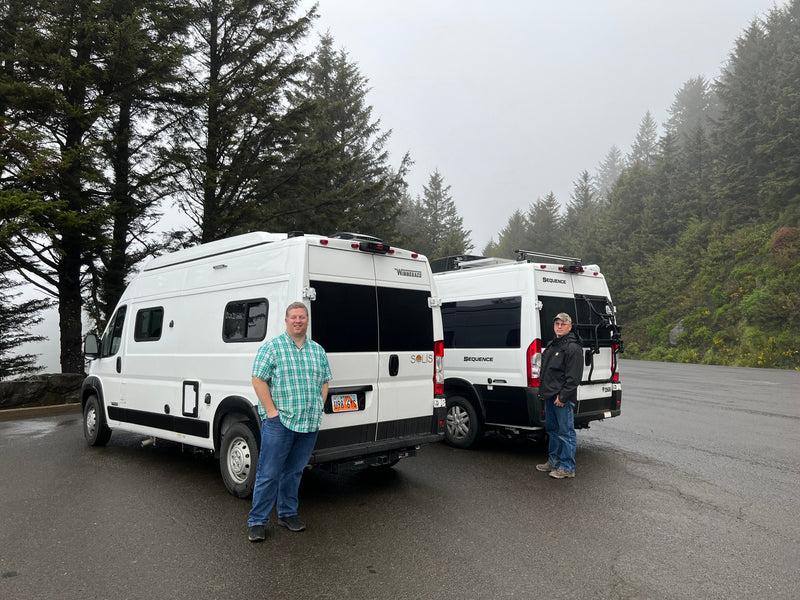  and seating area. Overhead storage and fire extinguisher visible.|Inside an RV rental: An illuminated ladder leads to a pop-top roof tent — photo 7