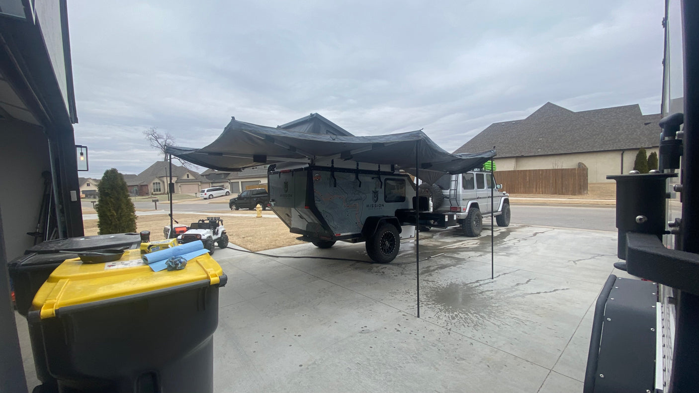 Mission Overland camping trailer with awning, towed by a G-Wagen. Perfect for an off-road RV rental experience.
